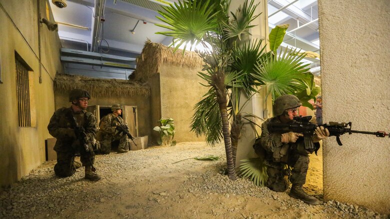 Marines with Company B, 1st Battalion, 2nd Marine Regiment, train in a simulated African village where they conduct patrols and defend a village from insurgents operating nearby during a training exercise at Marine Corps Base Camp Lejeune, N.C., June 23, 2016. Marines were able to practice tactics, communication within the unit, and combat readiness in a realistic training scenario, which better prepared them for a deployed environment.