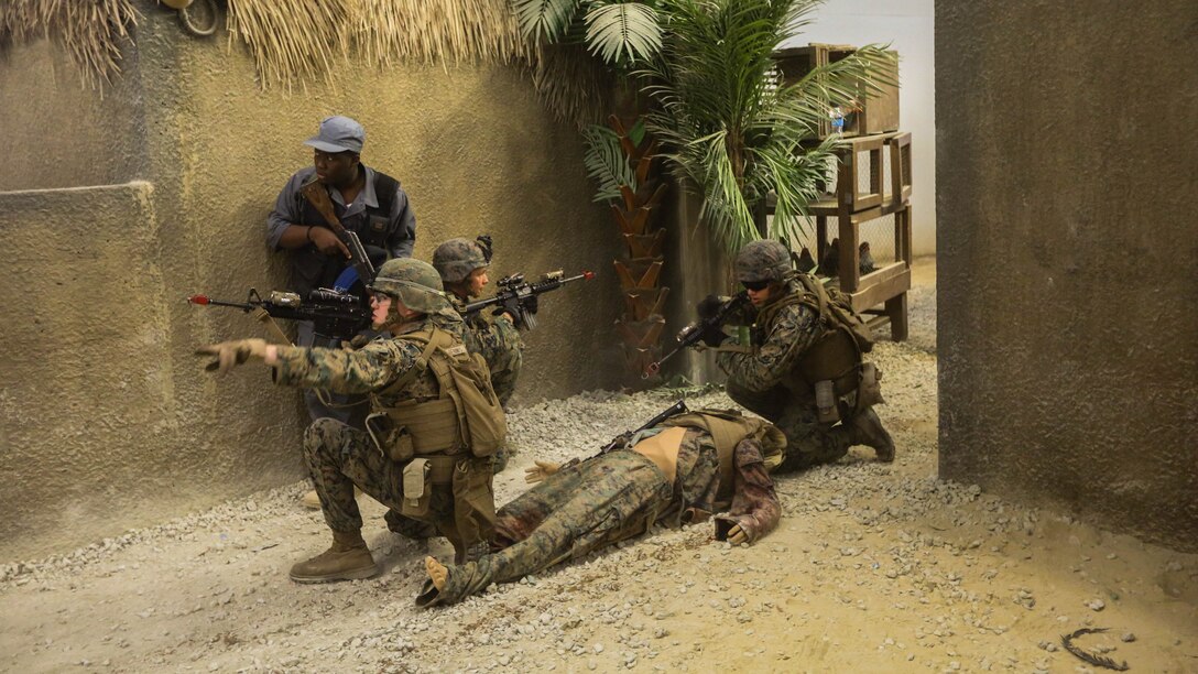Marines with Company B, 1st Battalion, 2nd Marine Regiment, train in a simulated African village where they conduct patrols and defend a village from insurgents operating nearby during a training exercise at Marine Corps Base Camp Lejeune, N.C., June 23, 2016. Marines were able to practice tactics, communication within the unit, and combat readiness in a realistic training scenario, which better prepared them for a deployed environment.
