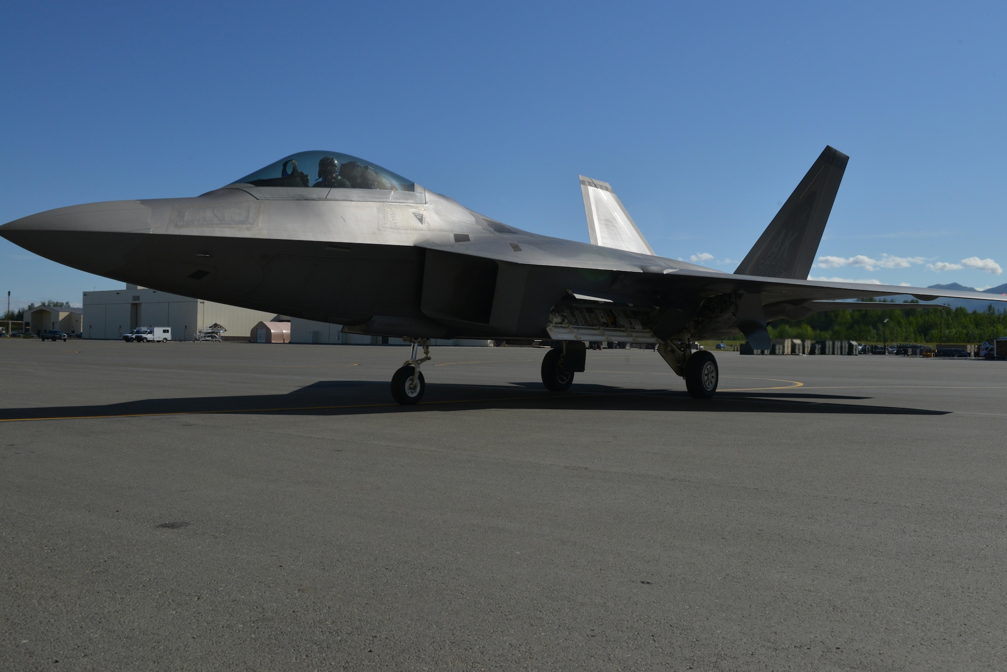 Air Force Lt. Col. Brandon Tellez, 525th Fighter Squadron commander and F-22 Raptor pilot, taxis in an F-22 after having flown his 1,000th hour in the fighter, at Joint Base Elmendorf-Richardson, Alaska, June 22, 2016. Tellez’s achievement comes after nine years as a Raptor pilot. (U.S. Air Force photo by Airman 1st Class Javier Alvarez)