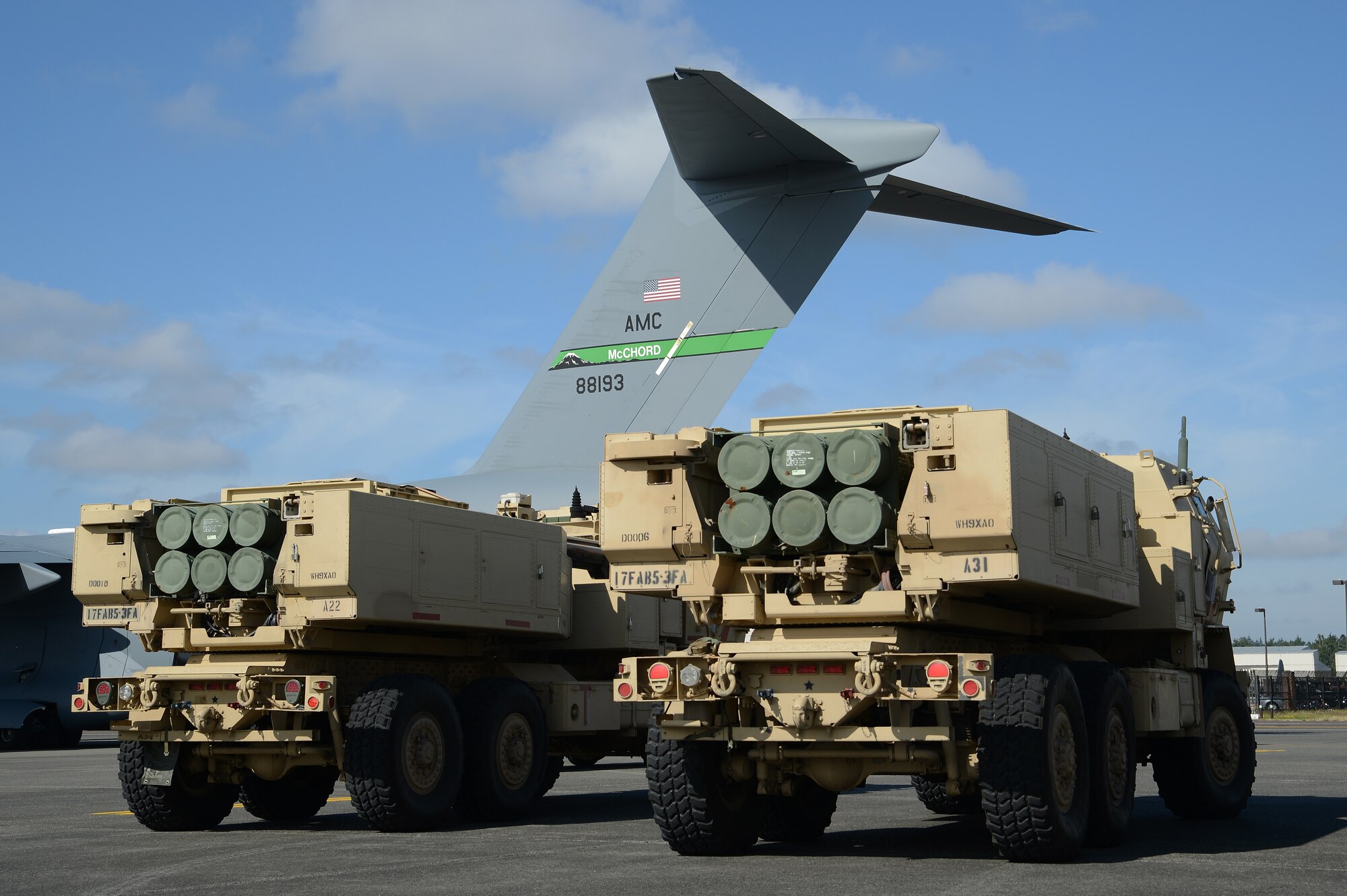 Two High Mobility Artillery Rocket Systems are prepped for loading onto a C-17 Globemaster III aircraft prior to a rapid infiltration HI-RAIN exercise June 22, 2016 at Joint Base Lewis-McChord, Wash. Each HIMARS weighs more than 20,000 pounds and is capable of carrying and firing six rockets. (U.S. Air Force photo/ Senior Airman Jacob Jimenez) 