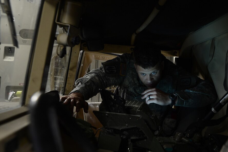 1st Lt. Kade Smith, 17th Field Artillery Brigade firing platoon leader, reviews targeting information for firing two High Mobility Artillery Rocket Systems in a rapid infiltration HI-RAIN exercise June 22, 2016 at Moses Lake, Wash. Soldiers used a command control vehicle during the exercise to receive information on simulated targets to fire upon. (U.S. Air Force photo/Senior Airman Jacob Jimenez) 