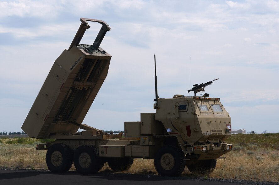 A High Mobility Artillery Rocket System simulates firing at a target during a rapid infiltration HI-RAIN exercise June 22, 2016 at Moses Lake, Wash. The joint training exercise allowed both Airmen and Soldiers to execute realistic simulated training of rapidly deploying long-range weapon systems. (U.S. Air Force photo/Senior Airman Jacob Jimenez) 