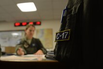 Capt. Kayla Hill (left), briefs 1st Lt. Amy Emmons, 7th Airlift Squadron pilots, during pre-mission planning for a rapid infiltration HI-RAIN exercise June 22, 2016 at Joint Base Lewis-McChord, Wash. Prior to each flight, pilots spend numerous hours planning flight operations and mission logistics. (U.S. Air Force photo/Senior Airman Jacob Jimenez) 