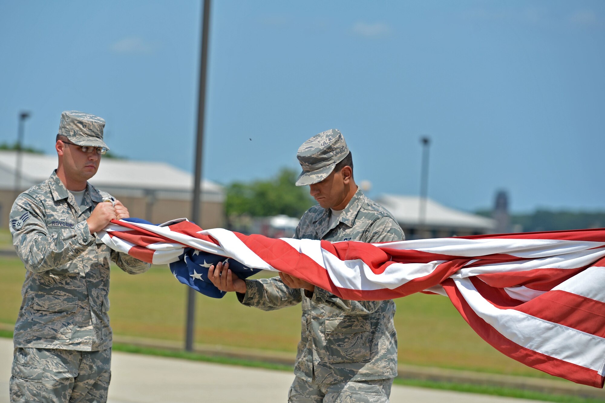 Airmen assigned to the Senior Master Sgt. David B. Reid Airman Leadership School fold a flag during a retreat ceremony at Shaw Air Force Base, S.C., June, 27, 2016. Since the separation of the Air Force from the Army in 1947, Airmen have performed retreat ceremonies at the end of the duty day to show respect to the flag. (U.S. Air Force photo by Airman 1st Class Christopher Maldonado) 