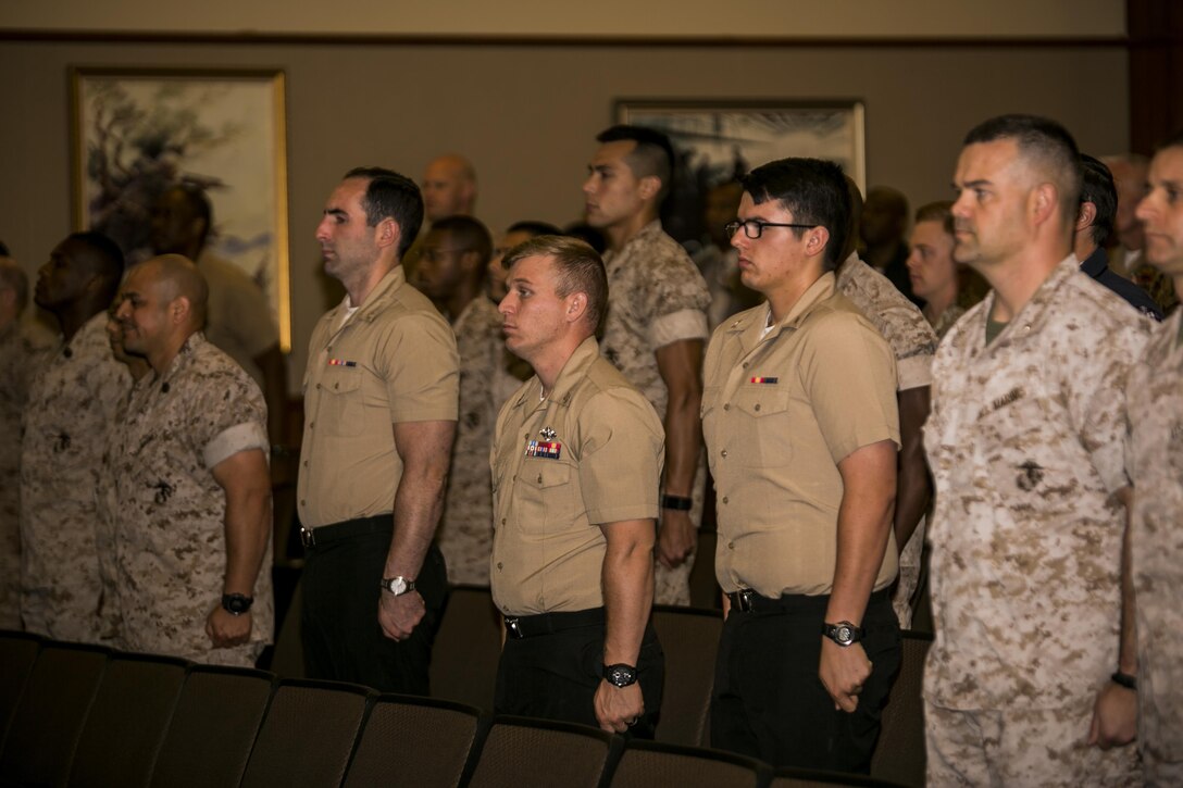 Corpsman with Marine Forces Reserve stand at attention during the playing of the Navy hymn, at their 118th Hospital Corpsman birthday celebration at Marine Corps Support Facility New Orleans, June 28, 2016. Today’s Hospital Corpsman are the most highly-trained and qualified force of medical professionals in Navy Medicine’s history. Since the establishment of the Hospital Corps in 1898, the corpsman field has grown from its first 25 apothecaries to the more than 30,000 corpsmen across the globe. 