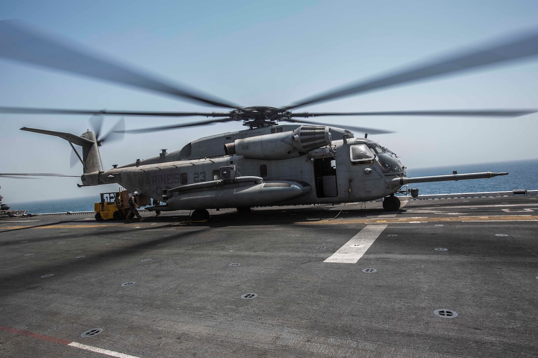 ARABIAN GULF (June 13, 2016) Marines and Sailors from the 13th Marine Expeditionary Unit load pallets into a CH-53E Super Stallion helicopter aboard USS Boxer (LHD 4), in preparation for sustainment training ashore in the U.S. 5th Fleet and Central Command areas of responsibility June 13. The 13th MEU is conducting sustainment training to maintain proficiency and combat readiness while deployed with the Boxer Amphibious Ready Group during Western Pacific Deployment 16-1. (U.S. Marine Corps photo by Cpl. Alvin Pujols/ RELEASED)