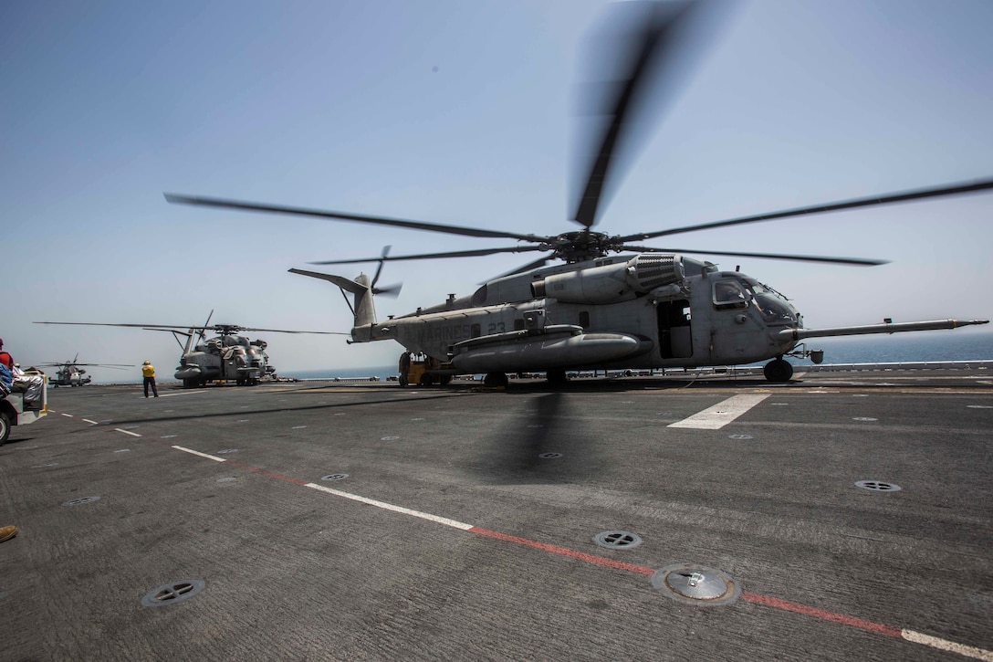 ARABIAN GULF (June 13, 2016) Marines and Sailors from the 13th Marine Expeditionary Unit load pallets into a CH-53E Super Stallion helicopter aboard USS Boxer (LHD 4), in preparation for sustainment training ashore in the U.S. 5th Fleet and Central Command areas of responsibility June 13. The 13th MEU is conducting sustainment training to maintain proficiency and combat readiness while deployed with the Boxer Amphibious Ready Group during Western Pacific Deployment 16-1. (U.S. Marine Corps photo by Cpl. Alvin Pujols/ RELEASED)