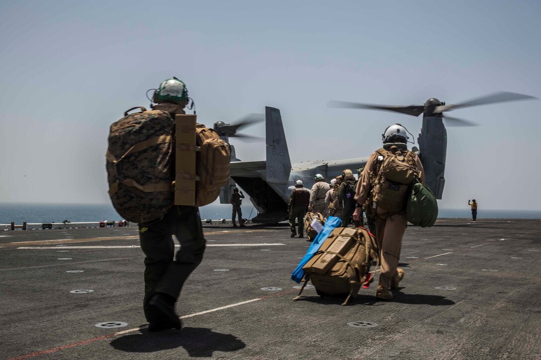 ARABIAN GULF (June 13, 2016) Marines and Sailors with the 13th Marine Expeditionary Unit and Boxer Amphibious Ready Group load into a U.S. Marine MV-22B Osprey helicopter aboard USS Boxer (LHD 4), in preparation for sustainment training ashore in the 5th Fleet and Central Command areas of responsibility June 13. The 13th MEU is conducting sustainment training to maintain proficiency and combat readiness while deployed with the Boxer Amphibious Ready Group during Western Pacific Deployment 16-1. (U.S. Marine Corps photo by Cpl. Alvin Pujols/ RELEASED)