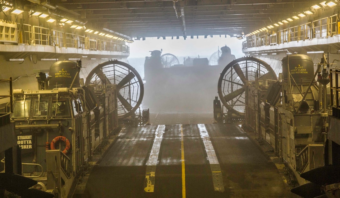 ARABIAN GULF (June 13, 2016) A Landing Craft Air-Cushion watercraft debarks the USS Boxer (LHD 4) to transport  troops and equipment ashore in preparation of sustainment training in the 5th Fleet and Central Command areas of responsibility June 13. The 13th MEU is conducting sustainment training to maintain proficiency and combat readiness while deployed with the Boxer Amphibious Ready Group during Western Pacific Deployment 16-1. (U.S. Marine Corps photo by Cpl. Alvin Pujols/RELEASED)