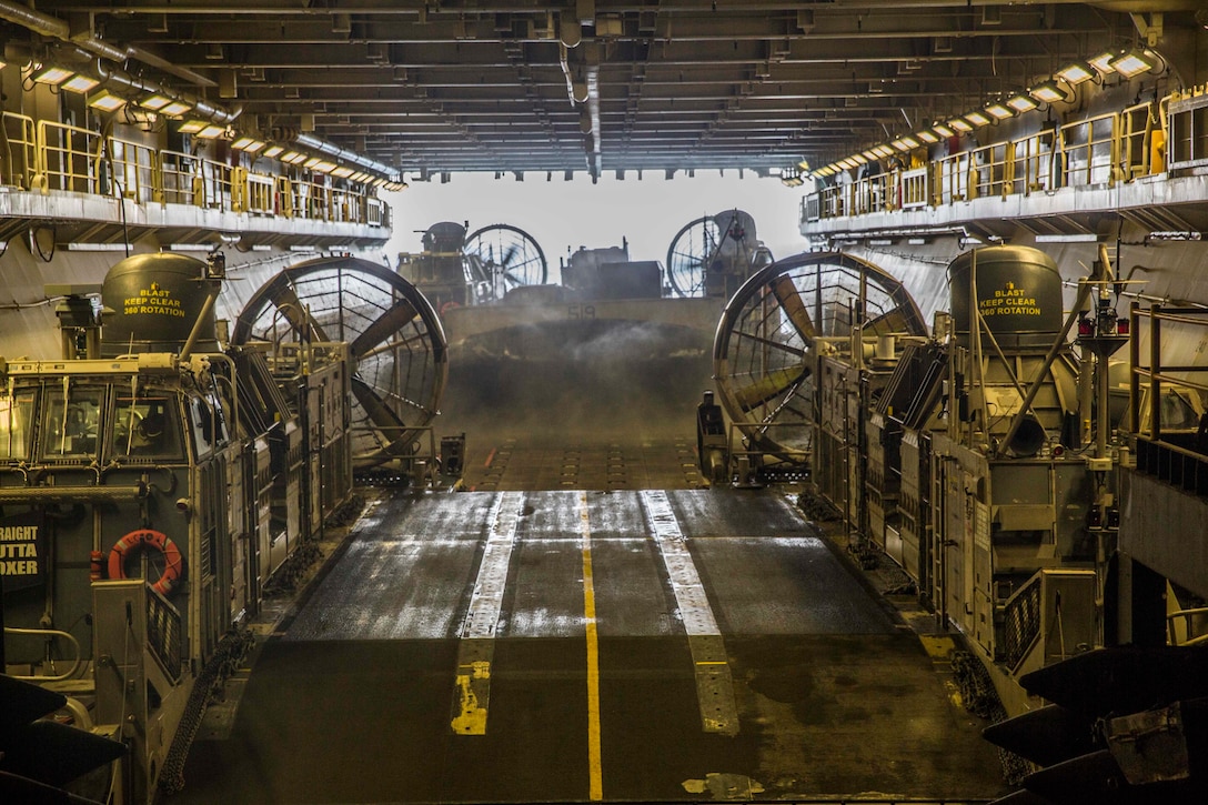 ARABIAN GULF (June 13, 2016) A Landing Craft Air-Cushion watercraft embarks the USS Boxer (LHD 4) after transporting  troops and equipment ashore in preparation of sustainment training in the 5th Fleet and Central Command areas of responsibility June 13. The 13th MEU is conducting sustainment training to maintain proficiency and combat readiness while deployed with the Boxer Amphibious Ready Group during Western Pacific Deployment 16-1. (U.S. Marine Corps photo by Cpl. Alvin Pujols/RELEASED)