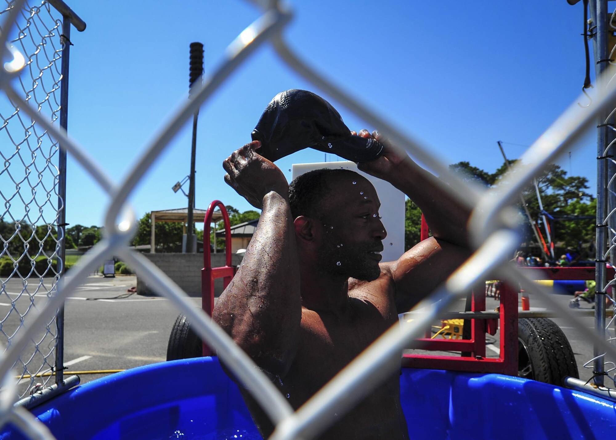 Chief Master Sgt. Quinton Burris, the public affairs functional manager for Air Force Special Operations Command, participates in the Hurlburt Chiefs’ Group dunk tank during the Sound of Independence at Hurlburt Field, Fla., June 24, 2016. The Sound of Independence is an annual Fourth of July celebration hosted by the 1st Special Operations Force Support Squadron. (U.S. Air Force photo by Airman 1st Class Joseph Pick)