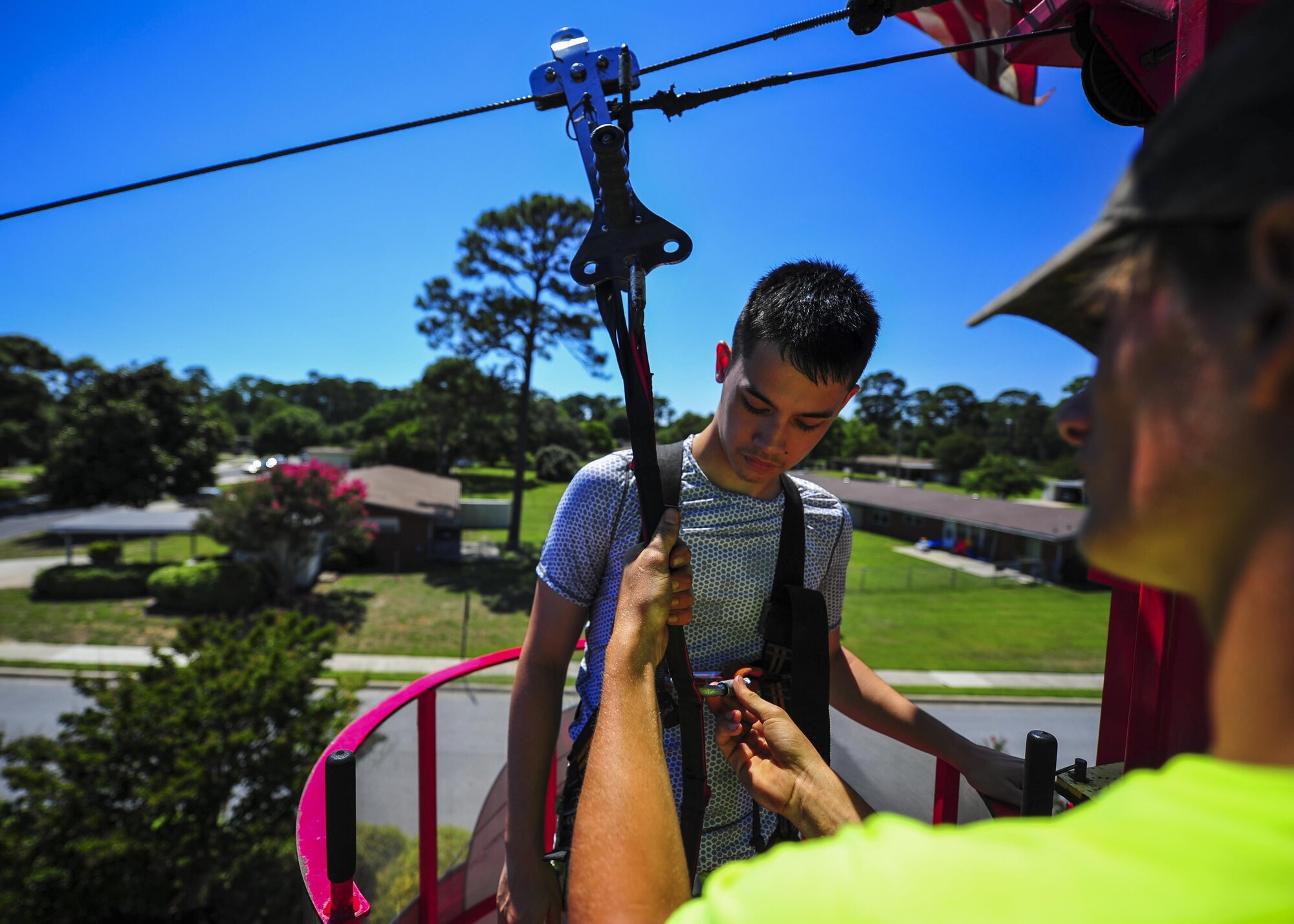 Airmen and their family members zipline as part of the Sound of Independence celebration at Hurlburt Field, Fla., June 24, 2016. The event is an annual Fourth of July celebration hosted by the 1st Special Operations Force Support Squadron. (U.S. Air Force photo by Airman 1st Class Joseph Pick)
