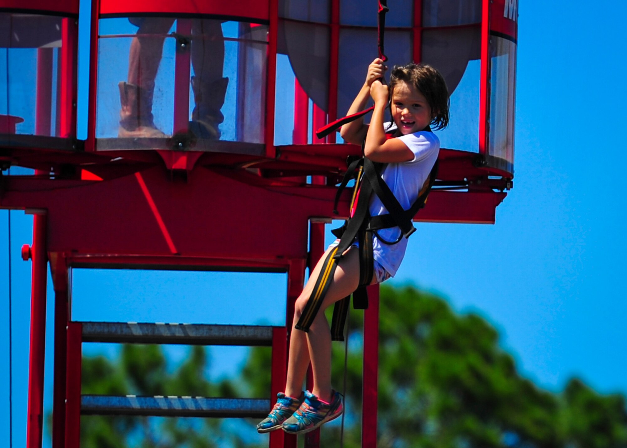 A child ziplines during the Sound of Independence at Hurlburt Field, Fla., June 24, 2016. For more than two decades, the Sound of Independence has traditionally been celebrated the Friday before Independence Day. (U.S. Air Force photo by Airman 1st Class Joseph Pick)