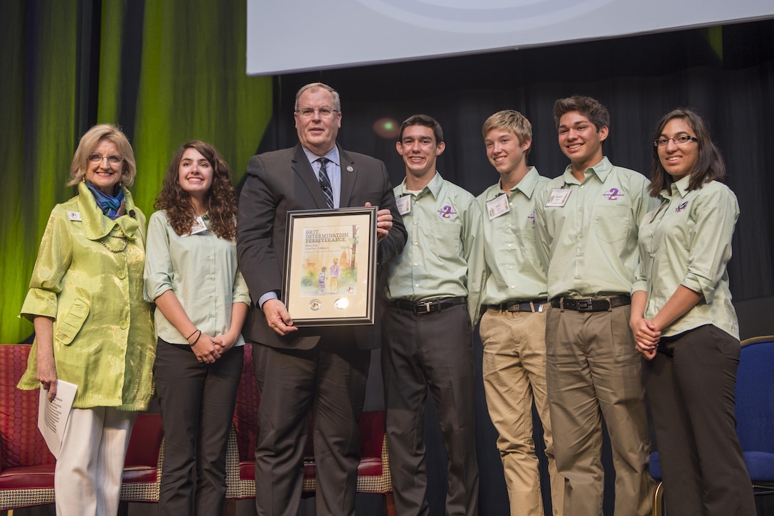 Deputy Defense Secretary Bob Work stands for a photo with youth participating in the Military Child Education Coalition's 2016 National Training Seminar in Washington, D.C., June 28, 2016. DoD photo by Air Force Staff Sgt. Brigitte N. Brantley