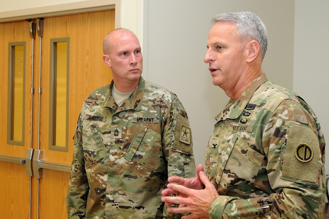 Army Master Sgt. James Samargo, left, Office of the Chief, Army Reserve, converses with Army Reserve Col. Robert S. Cooley, deputy commanding officer of the Army Reserve’s 85th Support Command, before a Fallen Soldier memorial held June 25, 2016. The memorial held at the 3rd Battalion, 383rd Regiment in St. Louis was to honor and remember Capt. Antonio D. Brown, a 3-383rd Soldier who was killed in the recent nightclub shooting in Orlando, Florida.
(U.S. Army photo by Sgt. Aaron Berogan/Released)