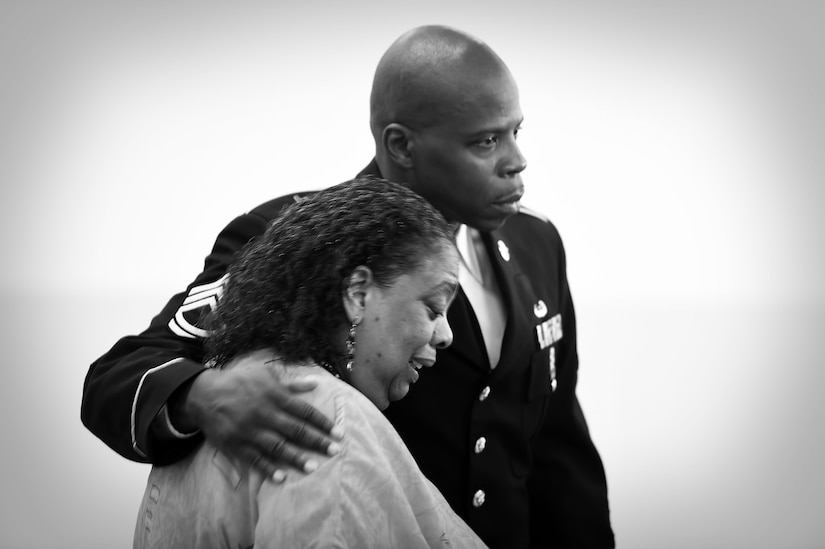 Virginia “Ginnie” Stephens is comforted by Sgt. First Class Gregory Santoni, assigned to the U.S. Army Reserve’s 3rd Battalion, 383rd Regiment, during a Fallen Soldier memorial held June 25, 2016. The memorial, held at the battalion in St. Louis, was in honor of Capt. Antonio D. Brown, a 3-383rd member killed in the recent nightclub shooting in Orlando, Florida.
(U.S. Army photo by Sgt. Aaron Berogan/Released)