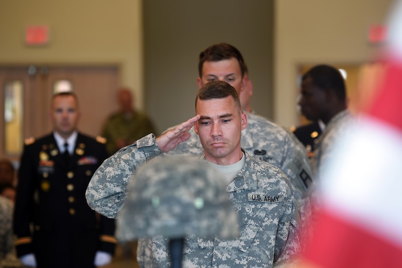 A soldier assigned to the U.S. Army Reserve’s 3rd Battalion, 383rd Regiment salutes the Fallen Soldier battle cross display during a Fallen Soldier memorial held June 25, 2016 at the battalion in St. Louis. Capt. Antonio D. Brown, a 3-383rd member, was one of the 49 victims killed in the Orlando nightclub shooting June 12, 2016.
(U.S. Army photo by Sgt. Aaron Berogan/Released)