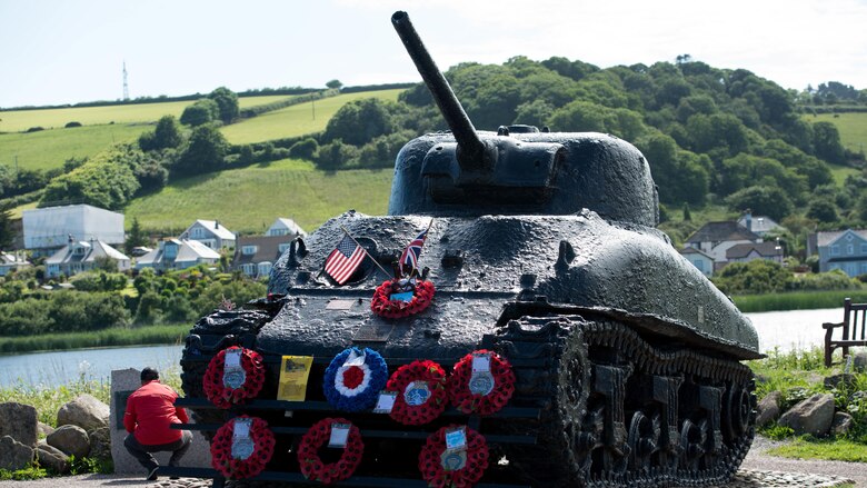 The All-Marine running team visits the memorial for Operation Tiger, June 24, 2016. The Sherman Tank was used in the D-Day practice at Slapton Beach. The tank was recovered in 1984 and is now a memorial to the 946 American service members who lost their lives that day. 