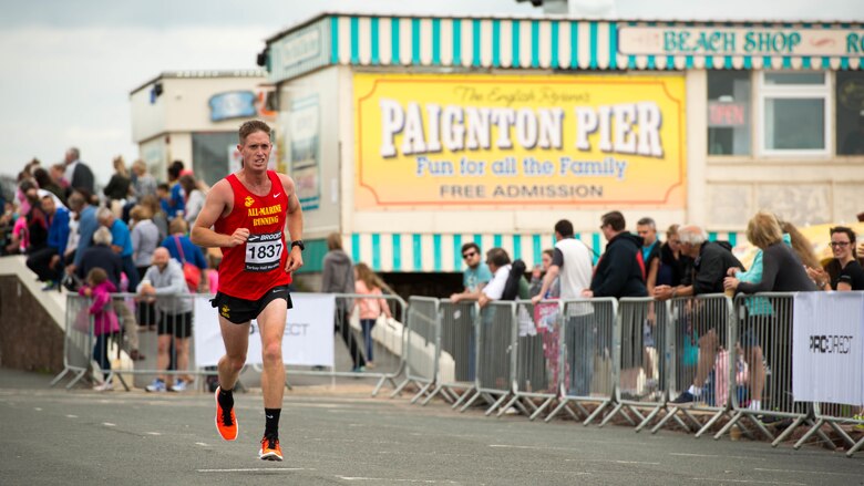 2nd Lt. Kyle King, the headquarters platoon commander and a fire direction officer with Battery C, 1st Battalion 11th Marine Regiment, at Marine Corps Base Camp Pendleton, California, runs at the Torbay Half Marathon in Torbay, England, June 26, 2016. King is a member of the All-Marine running team and competes in running events around the world to represent the U.S. Marine Corps. 