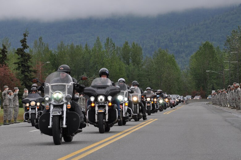 The funeral service for Fred "Bulldog" Becker IV was held at the Fort Richardson Cemetary June 24. Bulldog was heavily involved in the Anchorage community, and more than 1,000 Airmen and Soldiers lined the streets for his processional, consisting of hundreds of motorcyclists from around the community. (U.S. Air Force photo by Erin Eaton)