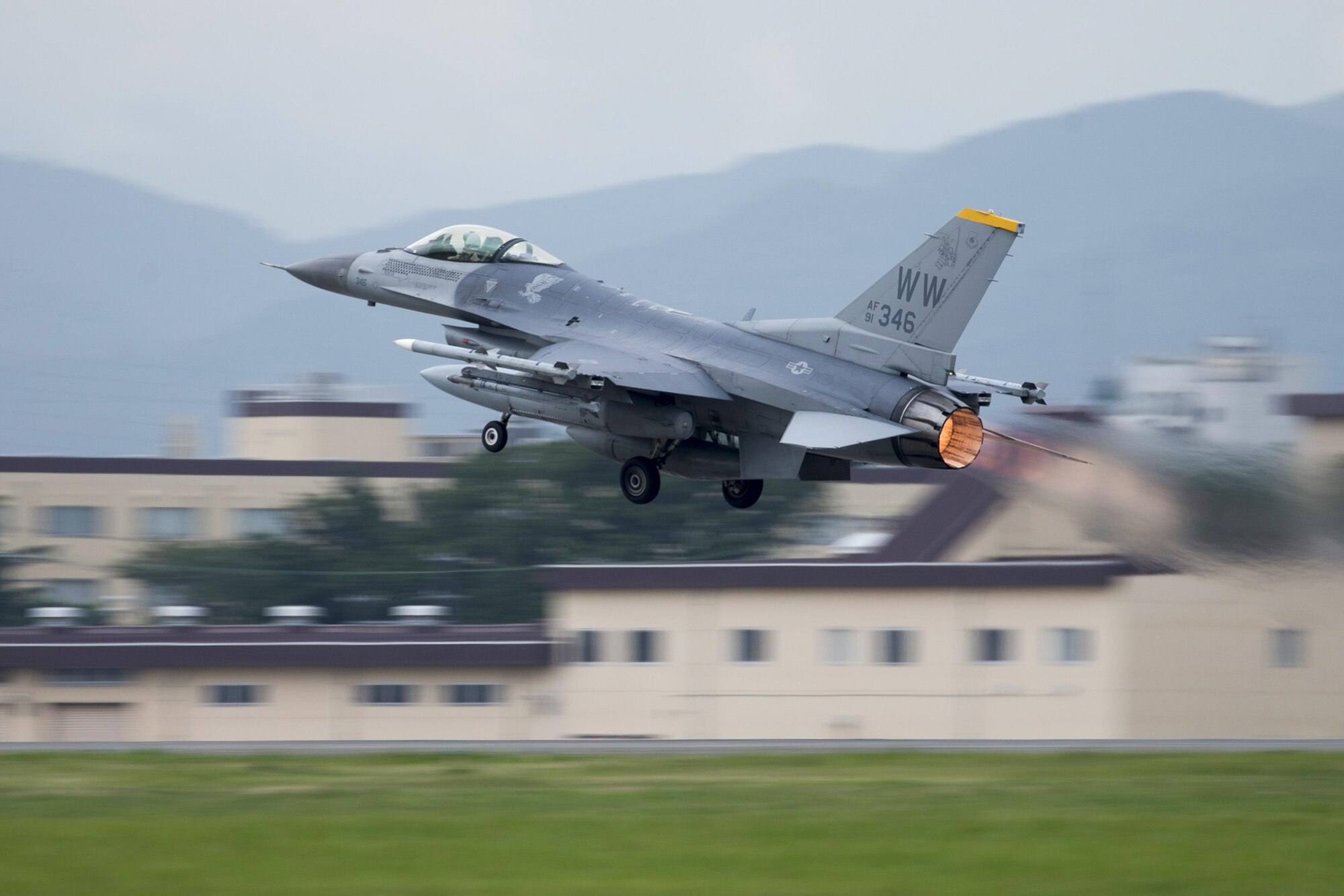 An F-16 Fighting Falcon, the “WW” tail flash, with the 35th Fighter Wing takes off at Yokota Air Base, Japan, June 24, 2016. The 35 FW from Misawa Air Base, Japan, provides the only suppression of enemy air defense (SEAD) mission operating out of the Indo-Asia Pacific Region. (U.S. Air Force photo by Yasuo Osakabe/Released)