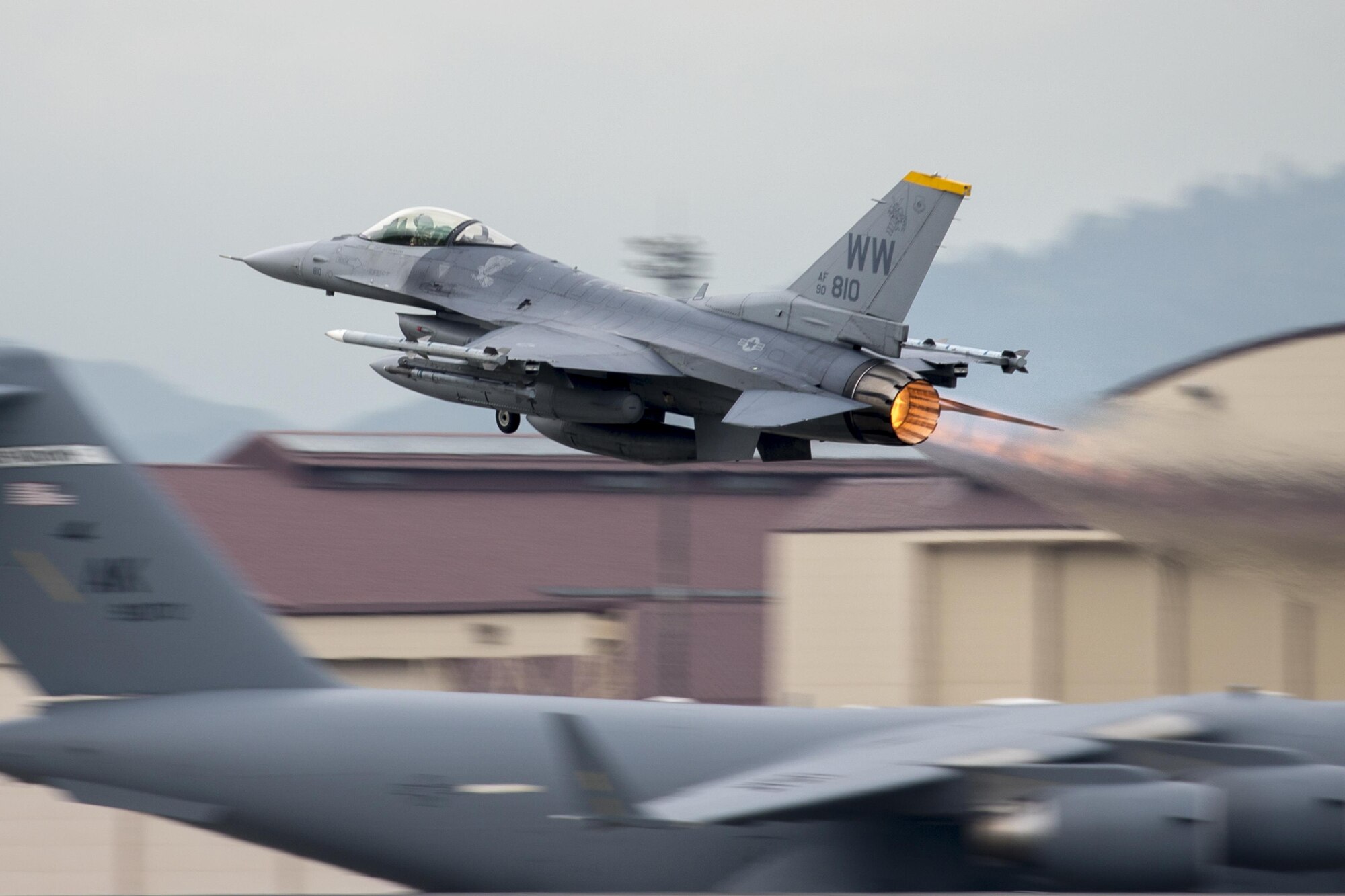 An F-16 Fighting Falcon with the 35th Fighter Wing departs Yokota Air Base, Japan, June 24, 2016. Seen exiting the end of the aircraft, the jet exhaust is ignited at the afterburner, producing a second stage of combustion and a steam of powerful, yet fuel inefficient, thrust. An F-16 Fighting Falcon uses afterburner in short bursts during takeoff, climb, or combat maneuvers. (U.S. Air Force photo by Yasuo Osakabe/Released) 