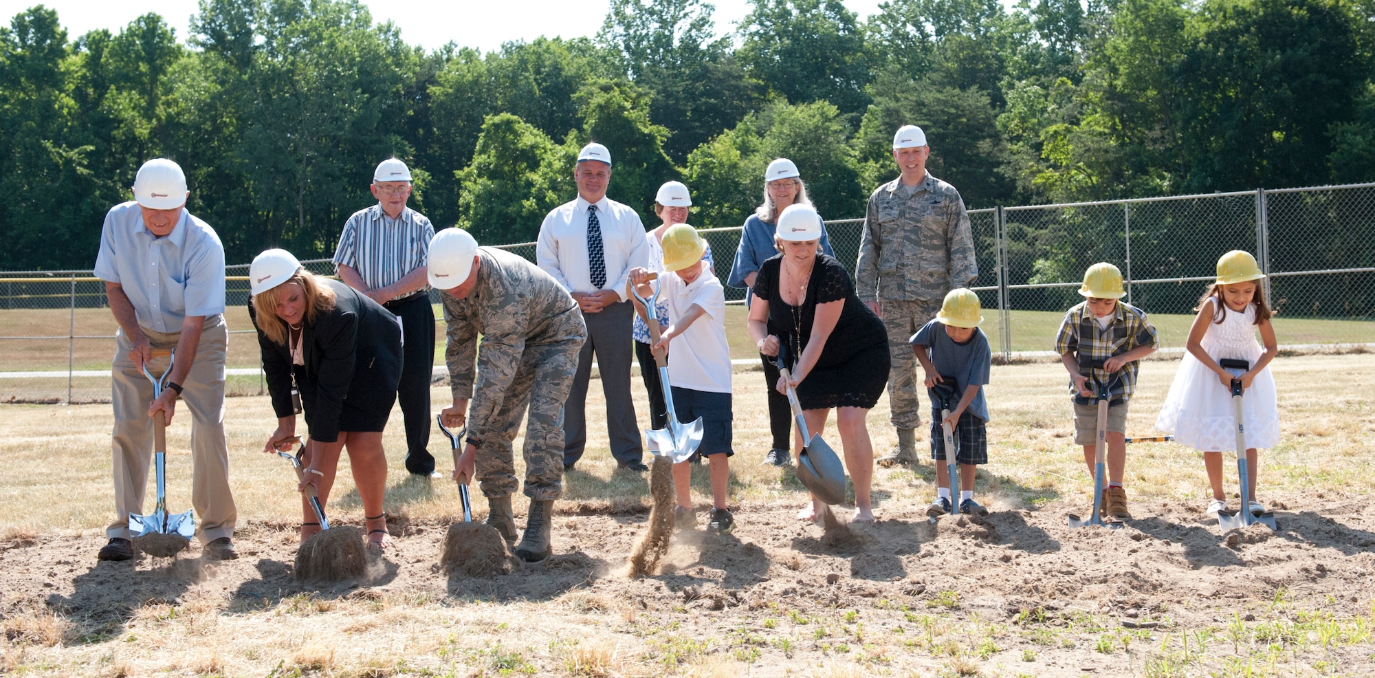 Joint Base McGuire-Dix-Lakehurst leaders, North Hanover Board of Education members and school-age children participate in a groundbreaking ceremony June 21, 2016, at the site where a new pre-k through fourth-grade school will built in the Falcon Court North area. The new school is estimated to cost $73 million and will serve 850 students. (U.S. Air Force photo by Pascual Flores/Released)