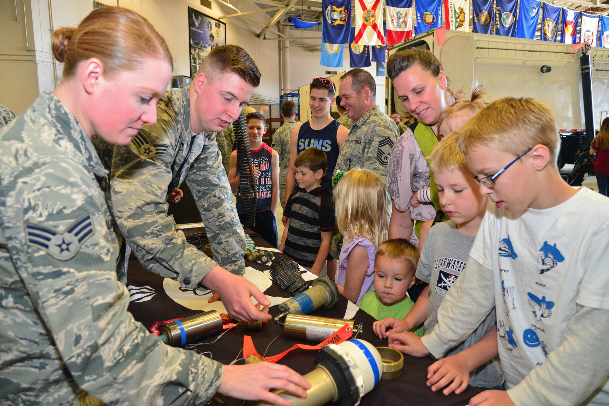 Families of Airmen from the 341st Maintenance Group attend an open house in the 3-Bay Hangar June 27, 2016, at Malmstrom Air Force Base, Mont. The open house allowed families to learn more about the jobs their Airmen perform every day. (U.S. Air Force photo/ Airman 1st Class Daniel Brosam)