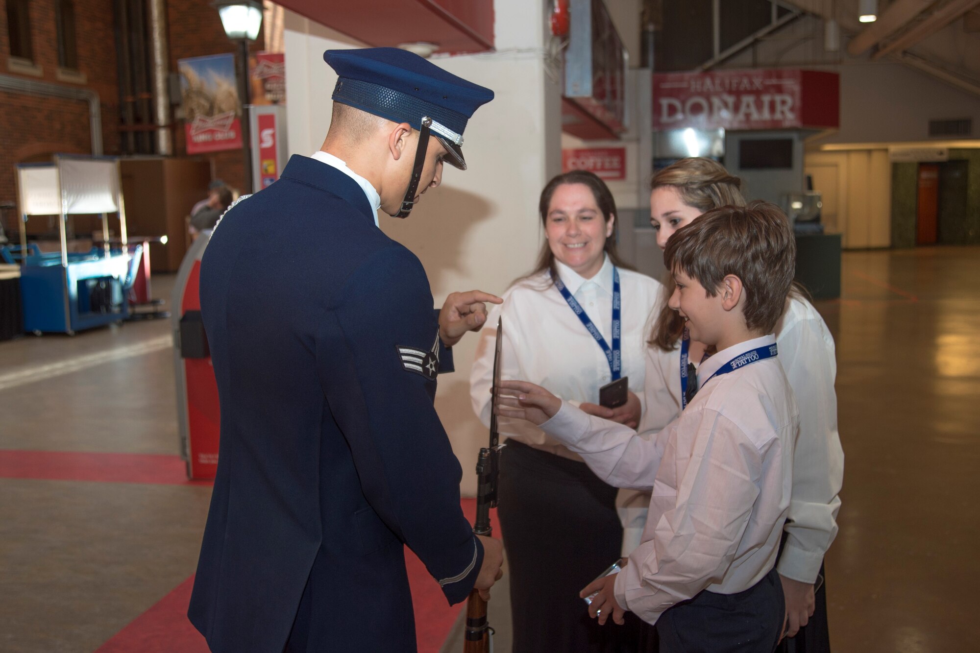 Senior Airman Angelo Hightower, U.S. Air Force Honor Guard Drill Team member, shows his M1 Garand rifle to members of the 2016 Royal Nova Scotia International Tattoo adult choir at the Scotiabank Centre in Halifax, Nova Scotia, June 27, 2016. The drill team is the only group representing the U.S. Other countries include Canada, Germany, Kenya, New Zealand and Switzerland. (U.S. Air Force photo by Senior Airman Ryan J. Sonnier)