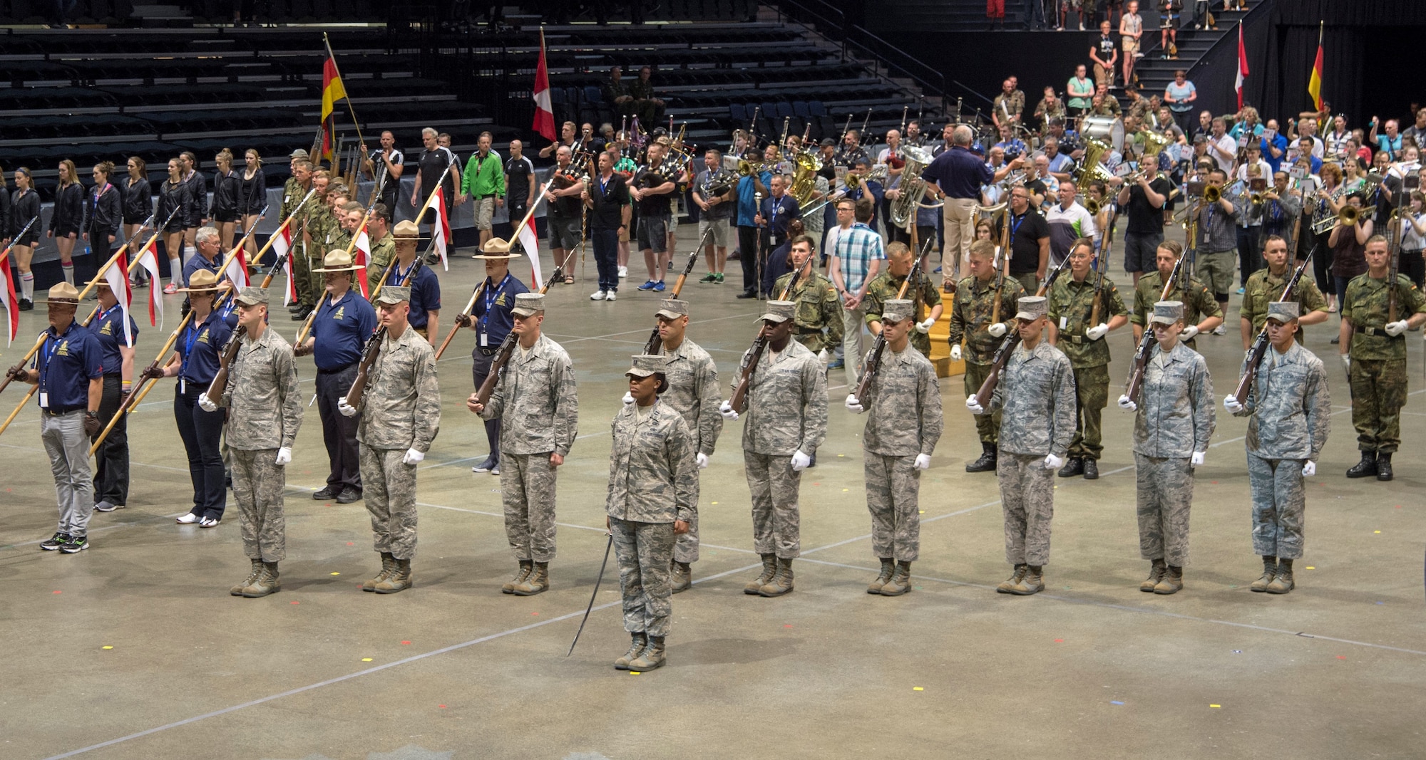 Members of the U.S. Air Force Honor Guard Drill Team stand in formation during the practice of the final act at a 2016 Royal Nova Scotia International Tattoo rehearsal at the Scotiabank Centre in Halifax, Nova Scotia, June 26, 2016. The tattoo included acts from Canada, Germany, Kenya, New Zealand, Switzerland and the U.S.(U.S. Air Force photo by Senior Airman Ryan J. Sonnier)