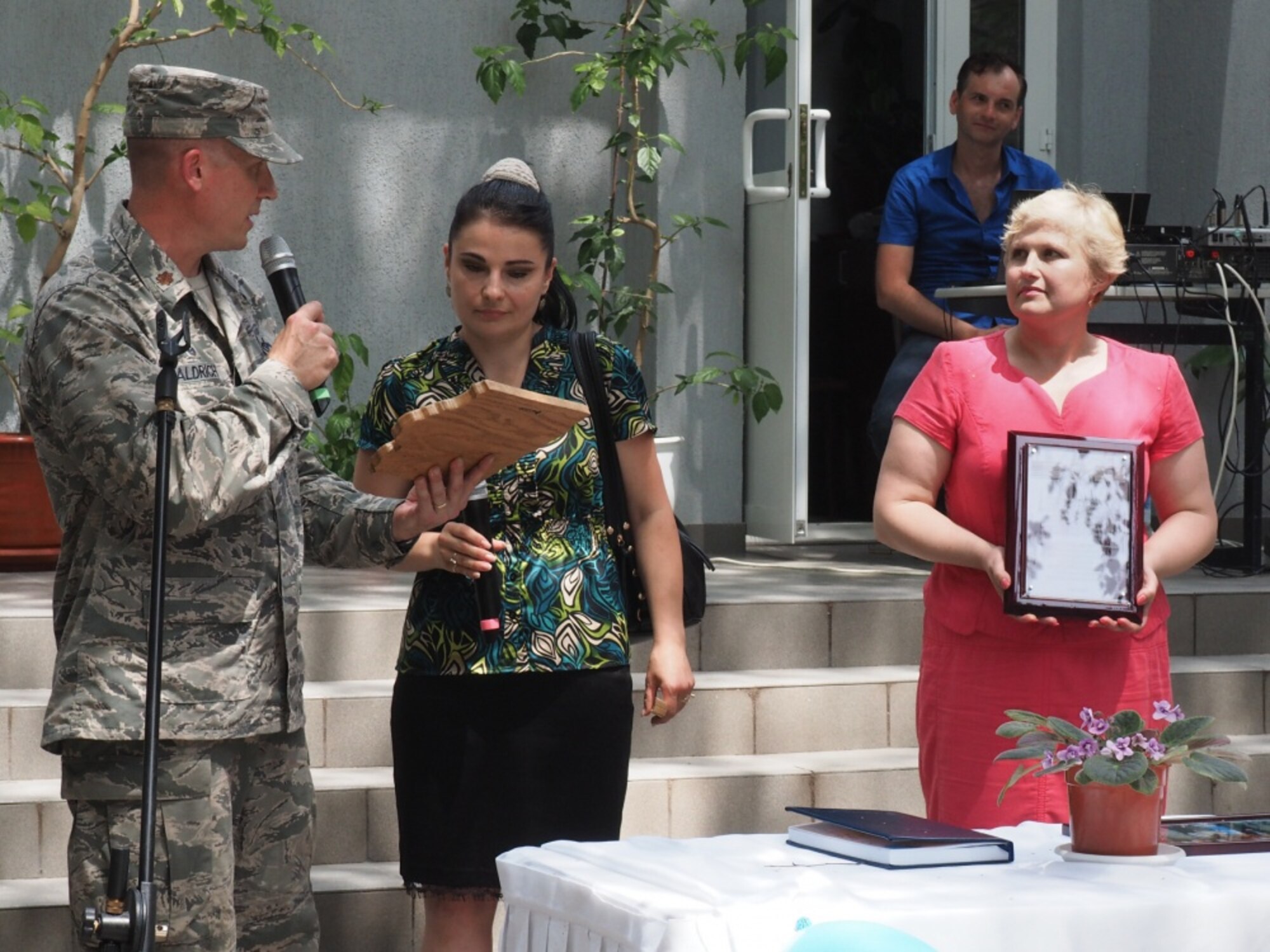 U.S. Air Force Maj. Kristian Aldrich (left), commander of the 185th Engineering Squadron, Iowa Air National Guard, presents a plaque to Nina Rusu (right), the principal of Special School Number 12, during a ceremony in Chisinau, Moldova, June 23, 2016. As part of the European Command’s (EUCOM) Humanitarian and Civic Assistance Program, the 123rd Civil Engineering Squadron from the Kentucky Air National Guard, 185th Engineering Squadron from the Iowa Air National Guard, 457th Civil Affairs Battalion and Moldovan Land Forces collaborate to renovate to the kitchen at Special School Number 12 for Hearing Impaired Children, in Chisinau, Moldova, June 3-25, 2016. (U.S. Army Photo by Pfc. Emily Houdershieldt/released) 