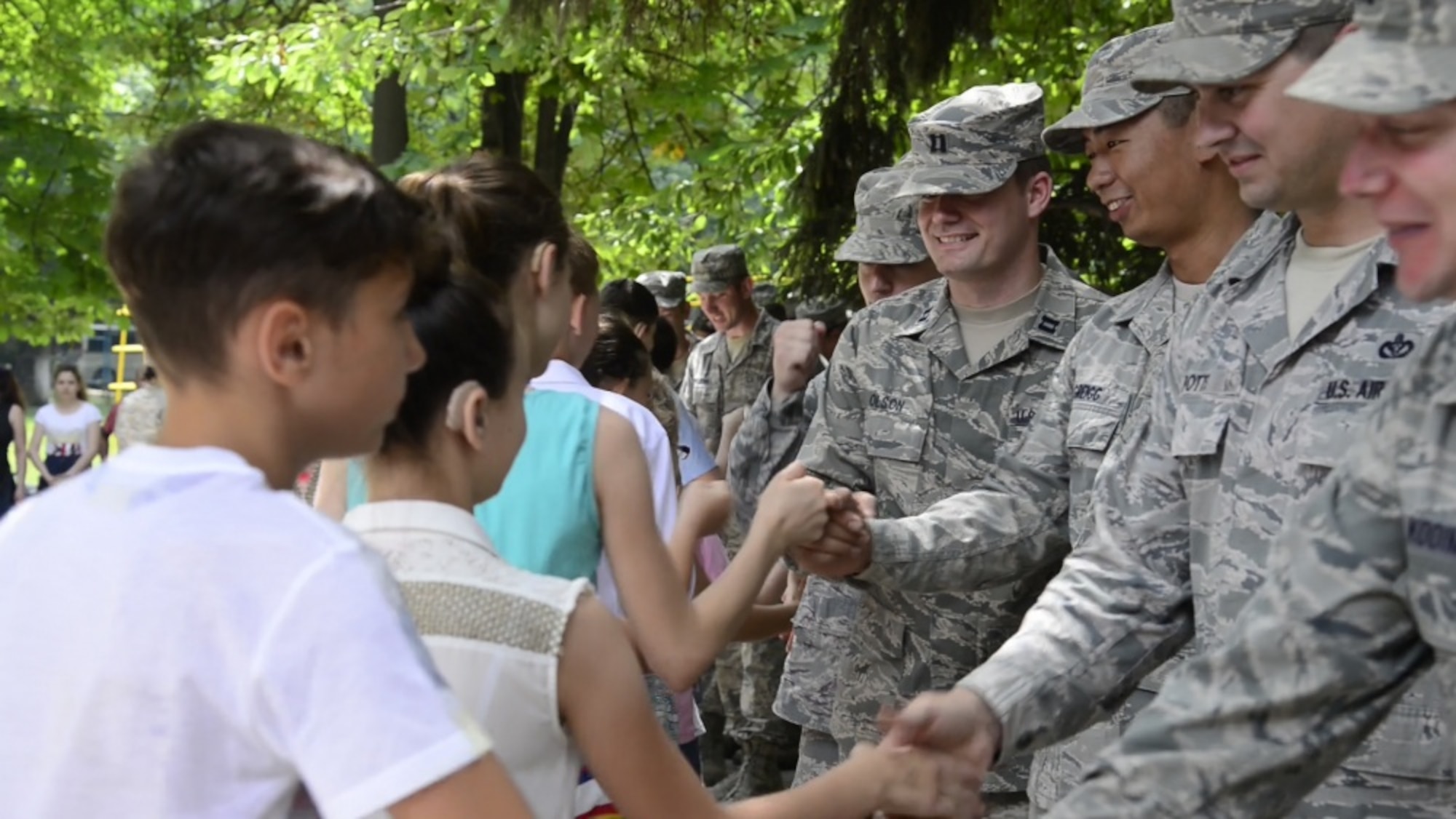 Children from Special School Number 12 thank the U.S. Airmen, assigned to the 185th Civil Engineering Squadron, Iowa Air National Guard, for their hard work, during a Humanitarian Civil Assistance (HCA) project in Chisinau, Moldova, June 23, 2016. As part of the European Command’s (EUCOM) Humanitarian and Civic Assistance Program, the 123rd Civil Engineering Squadron from the Kentucky Air National Guard, 185th Engineering Squadron from the Iowa Air National Guard, 457th Civil Affairs Battalion and Moldovan Land Forces collaborate to renovate to the kitchen at Special School Number 12 for Hearing Impaired Children, in Chisinau, Moldova, June 3-25, 2016. (U.S. Army Photo by Pfc. Emily Houdershieldt/released) 