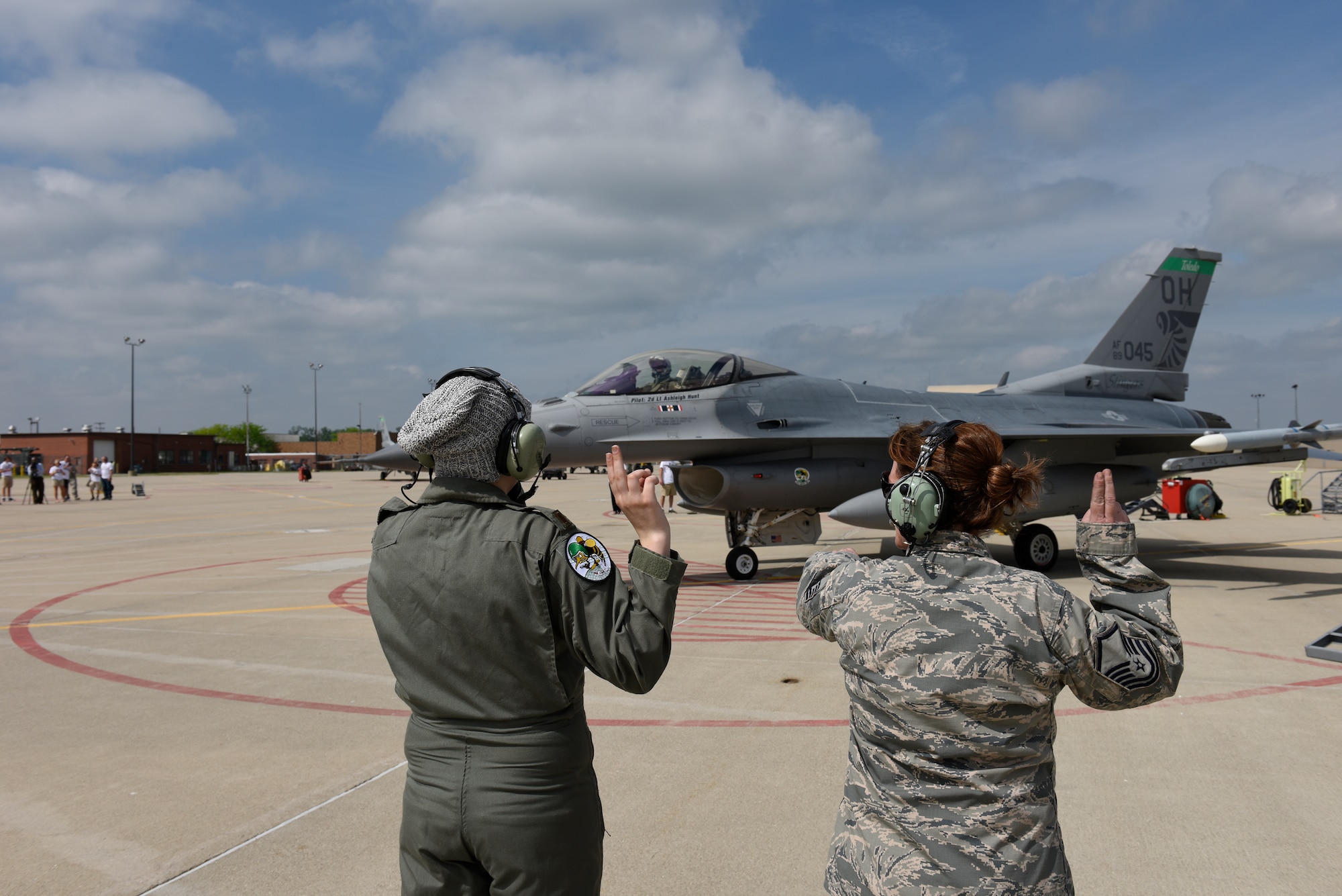 Honorary 2nd Lt. Ashleigh Hunt and U.S. Air Force Master Sgt. Kathryn L. Dorhmann, a crew chief assigned to the 180th Fighter Wing, launch an F-16 Fighting Falcon May 26, 2016 during Pilot for a Day, a program supporting children and young adults who live with chronic or life-threatening illnesses. The Pilot for a Day program allows the 180FW to give back to the local community, whose enduring support for the Airmen makes the 180FW mission possible. (U.S. Air National Guard photo by Staff Sgt. Shane Hughes)