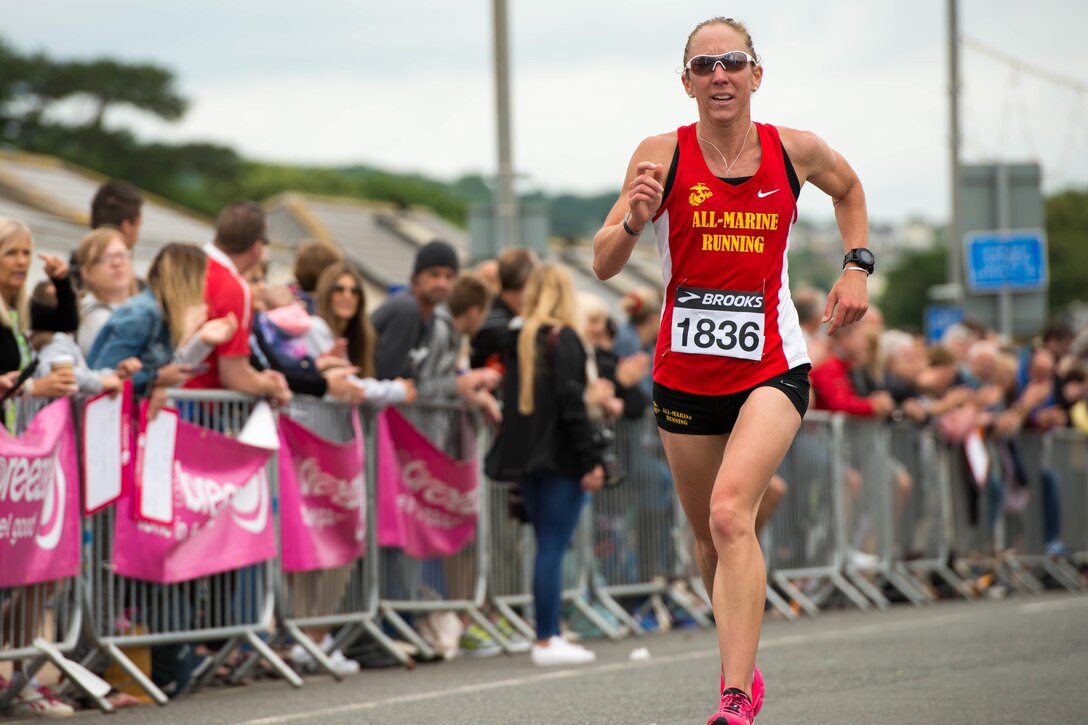 Marine Corps Capt. Christine Taranto runs in the Torbay Half Marathon in Torbay, England, June 26, 2016. Taranto, a logistics analyst and member of the All-Marine running team, finished second among women with a time of 1:23:05. Marine Corps photo by Lance Cpl. Timothy R. Smithers