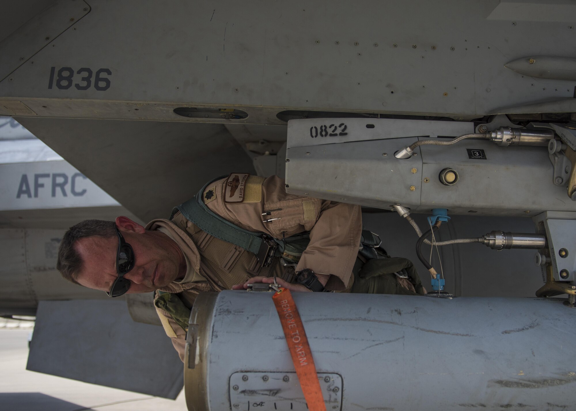 Lt. Col. David Efferson, 457th Expeditionary Fighter Squadron commander, conducts a pre-flight inspection of an F-16C Fighting Falcon, June 28, 2016, Bagram Airfield, Afghanistan. The aircraft receives inspections before takeoff and after landing to see if there are any maintenance issues with the aircraft. (U.S. Air Force photo by Senior Airman Justyn M. Freeman)