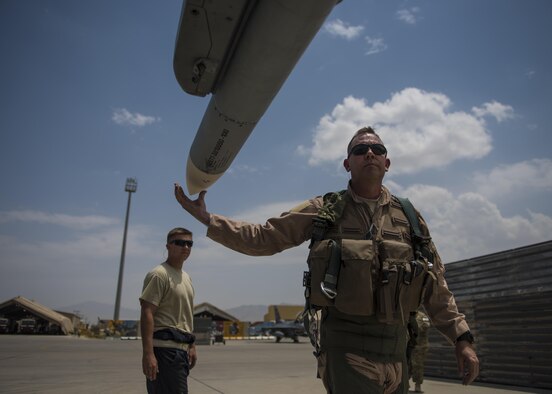 Lt. Col. David Efferson, 457th Expeditionary Fighter Squadron commander, conducts a pre-flight inspection of an F-16C Fighting Falcon, June 28, 2016, Bagram Airfield, Afghanistan. The F-16C is a compact, multi-role fighter aircraft that is highly maneuverable in air-to-air combat and air-to-surface attacks. (U.S. Air Force photo by Senior Airman Justyn M. Freeman)