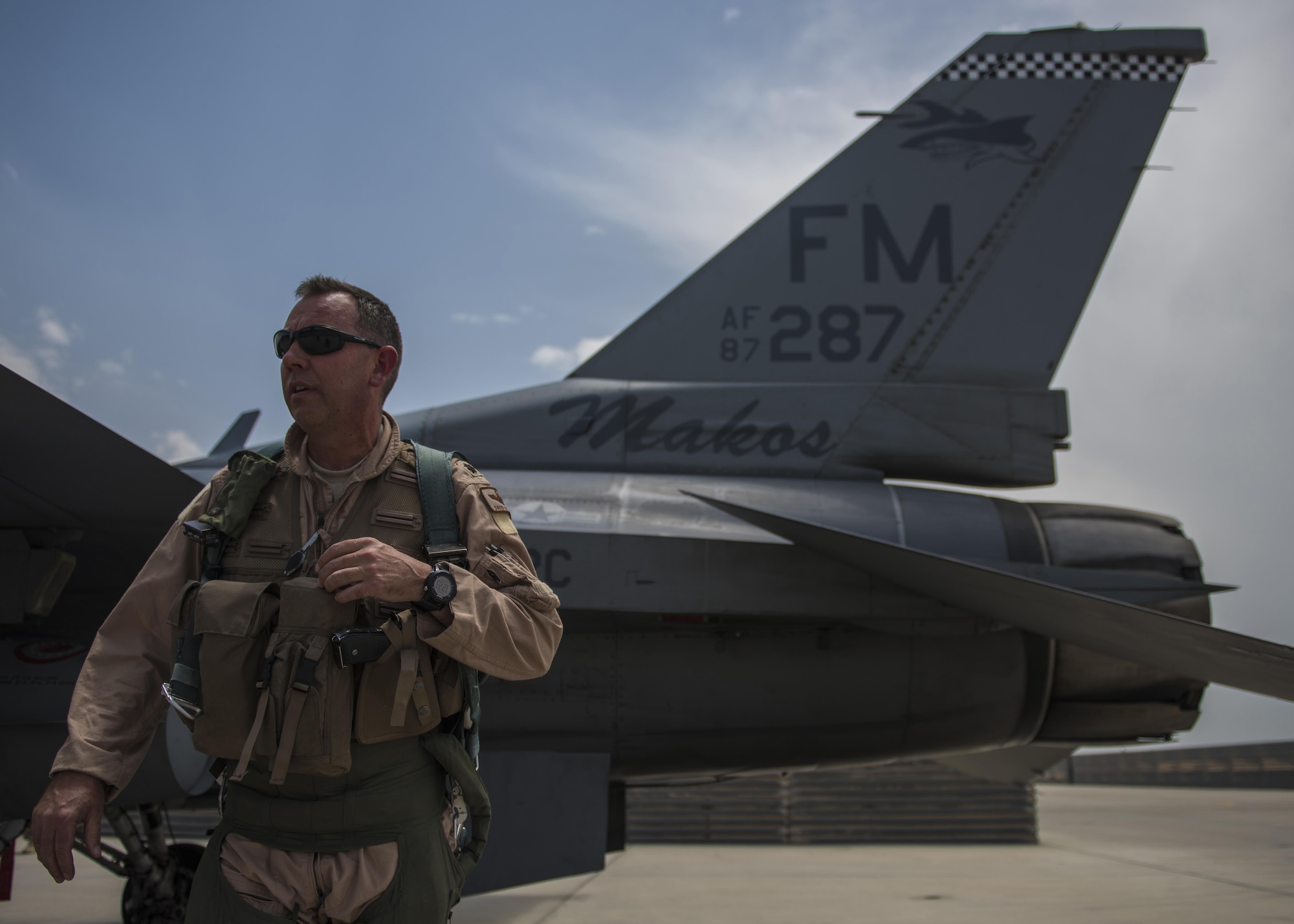 Lt. Col. David Efferson, 457th Expeditionary Fighter Squadron commander, conducts a pre-flight inspection of an F-16C Fighting Falcon, June 28, 2016, Bagram Airfield, Afghanistan. The aircraft receives inspections before takeoff and after landing to see if there are any maintenance issues with the aircraft. (U.S. Air Force photo by Senior Airman Justyn M. Freeman)