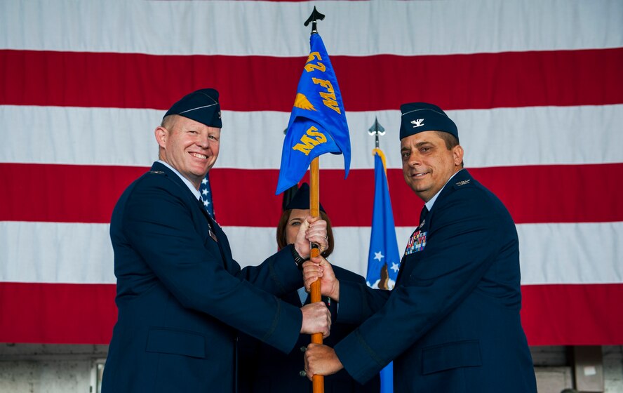 U.S. Air Force Col. Joe McFall, 52nd Fighter Wing commander, left, passes the 52nd Mission Support Group guidon to U.S. Air Force Col. Steven Zubowicz, incoming commander of 52nd MSG, during the group’s assumption of command ceremony in Hangar One at Spangdahlem Air Base, Germany, June 24, 2016. The passing of the guidon symbolizes the official transfer of authority handed to the new commander by the wing commander. (U.S. Air Force photo by Airman 1st Class Timothy Kim/Released)