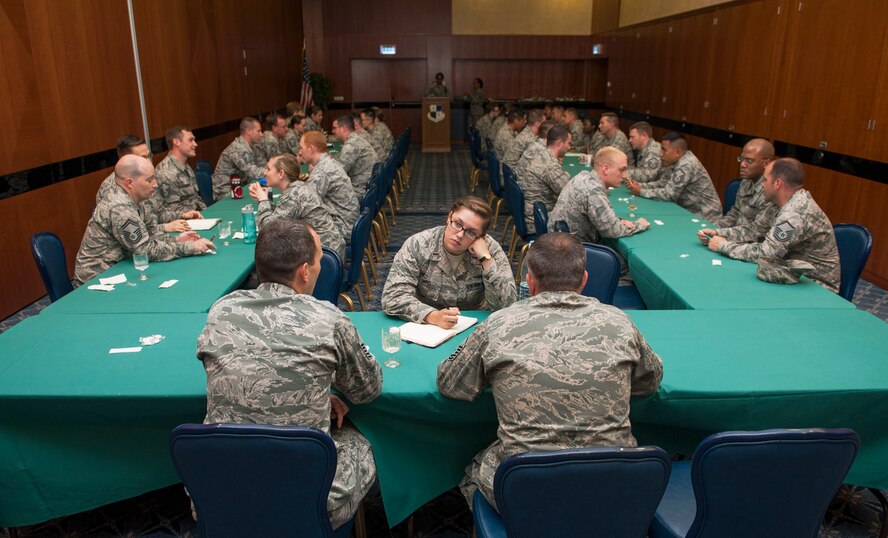 U.S. Air Force officers and senior NCOs attend a speed mentoring session at Club Eifel on Spangdahlem Air Base, Germany, June 28, 2016. The session provided an environment in which company grade officers could ask for and receive advice from senior NCOs in three-minute intervals. (U.S. Air Force photo by Airman 1st Class Timothy Kim/Released)