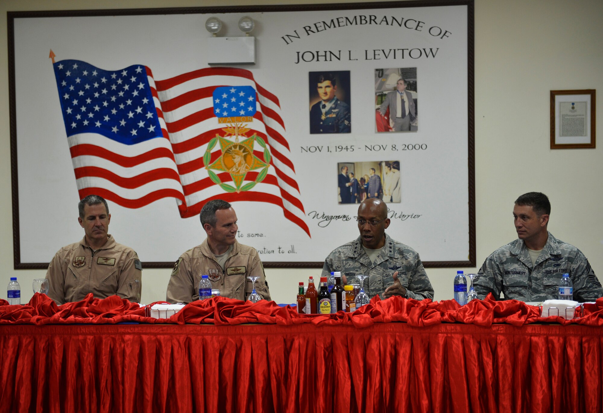 From left, Col. Johnny Barnes, 380th Air Expeditionary Wing vice commander,  Brig. Gen. Charles Corcoran, 380th AEW commander, Lt. Gen. Charles Brown, U.S. Air Forces Central Command commander, and Chief Master Sgt. Joseph Montgomery, AFCENT command chief, speak with members of the 380th AEW during lunch at an undisclosed location in Southwest Asia June 28, 2016. Brown visited the location to interact with members of the wing and to discuss the 380th AEW’s contributions to the AFCENT mission. (U.S. Air Force photo by Tech. Sgt. Chad Warren)