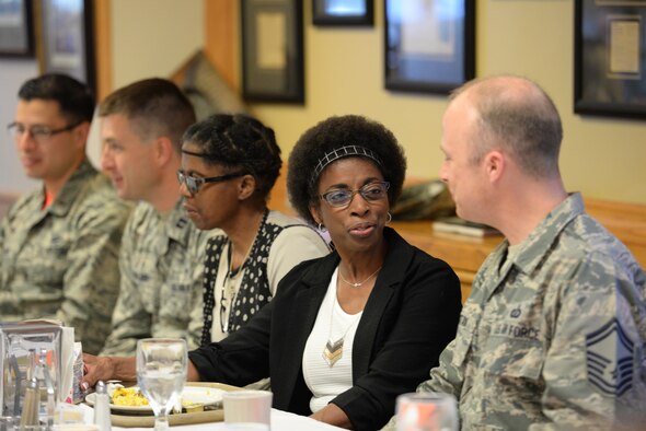 Yvette King, widow of Staff Sgt. Ronald L. King, speaks to Senior Master Sgt. Jeremy Swistak, superintendent of the 55th Contracting Squadron at Offutt Air Force Base, Neb., in the Ronald L. King Dining Facility June 24, 2016. King attended the 55th CONS memorial breakfast to commemorate her husband, a former member of the 55th CONS, on the 20th anniversary of his death in the attack on Khobar Towers in Dhahran, Saudi Arabia, June 25, 1996.