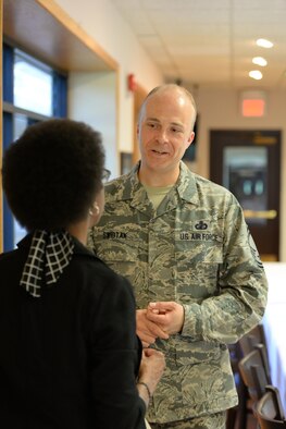 Senior Master Sgt. Jeremy Swistak, superintendent of the 55th Contracting Squadron at Offutt Air Force Base, Neb., speaks with Yvette King, widow of the late Staff Sgt. Ronald L. King, a former member of the 55th CONS in the Ronald L. King Dining Facility at Offutt June 24, 2016. They both attended a momorial breakfast to commemorate Sgt. King, who died in the the attack on Khobar Towers, in Dhahran, Saudi Arabia, June 25, 1996.