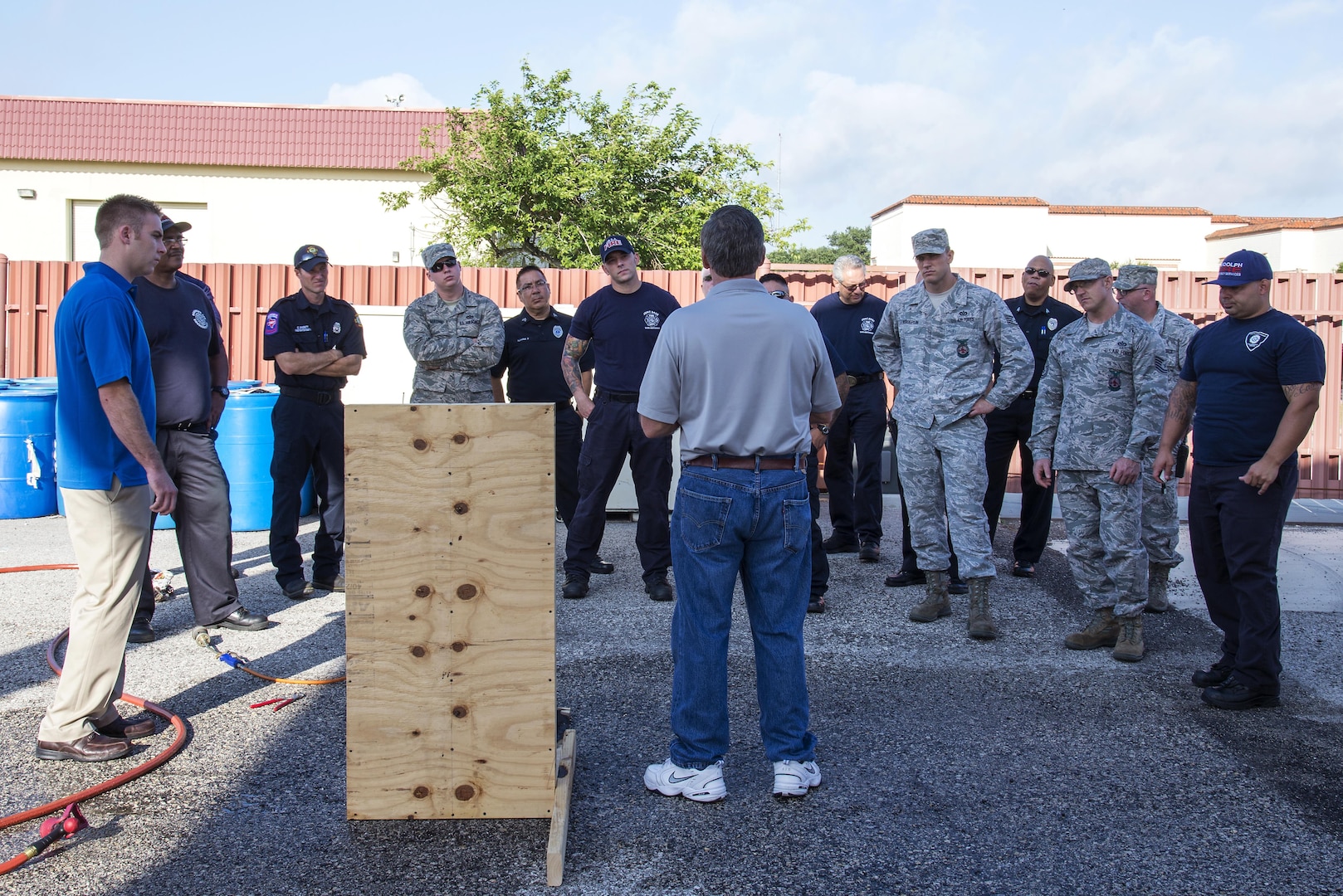 Bret Stohr, Insource fire service consultant and U.S. Air Force retired operations assistant chief, gives instruction to members from the Joint Base San Antonio Fire Department, Universal City Fire Department, Live Oak Fire Department and the 902nd Security Forces Squadron at JBSA-Randolph June 22, 2016. Stohr received Department of Defense Firefighter of The Year, U.S. Air Force Fire Officer and Chief Fire Officer of The Year distinctions while serving. 