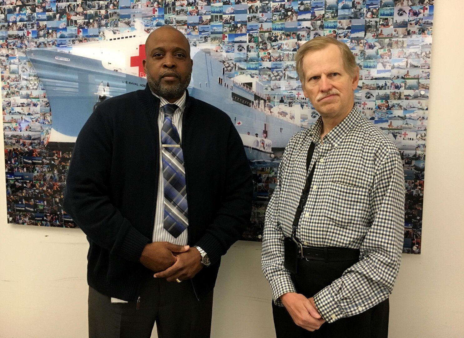 Kenneth Cummings (left) performed the Heimlich maneuver June 22 on his co-worker Arthur Tehson, who was choking on a doughnut. The Medical supply chain employees have sat behind each other since March 2015.
