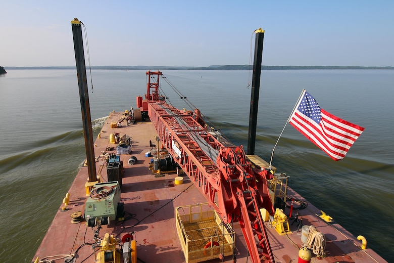 The Tulsa District U.S. Army Corps of Engineers navigation maintenance vessel, Mr. Pat, travels across Robert S. Kerr Lake on the McClellan-Kerr Arkansas River Navigation System to perform maintenance at Lock and Dam 15, near Sallisaw, Oklahoma, June 15, 2016. Mr. Pat was christened and put into service at the District on June 28, 1996, and for the past 20 years has been instrumental in the facilitation of maintenance along the Tulsa District's portion of the MKARNS. (U.S. Army Corps of Engineers photo by Preston Chasteen/Released)