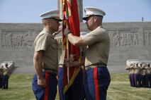 Major Alfred L. Butler IV, outgoing Marine Corps Recruiting Station Kansas City commanding officer, prepares to pass the recruiting station's unit colors to Maj. Byron R. Johnson, incoming recruiting station commanding officer, during the RS's change-of-command ceremony at the Liberty Memorial, June 23, 2016. The passing of the unit colors represents the formal passing of responsibility of one commanding officer to another and ensures a unit is never without official leadership.
