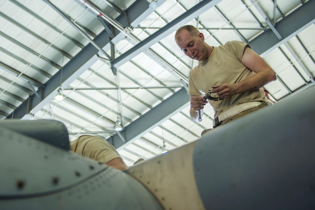 Air Force Senior Airman Shannon Wilson uses a beta tube spanner wrench to replace a beta tube in a C-130J Super Hercules aircraft engine at Bagram Airfield, Afghanistan, June 27, 2016. Wilson is a crew chief assigned to the 455th Expeditionary Aircraft Maintenance Squadron. The beta tube allows oil pressure to be directed to or from the propeller piston. Air Force photo by Senior Airman Justyn M. Freeman
