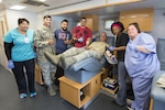 Brig. Gen. Bob LaBrutta, 502nd Air Base Wing and Joint Base San Antonio commander, visits the 59th Medical Wing’s Lackland Blood Donor Center bus to donate blood June 21 at JBSA-Randolph. The Lackland Blood Donor Center supplies blood products to warfighters at overseas contingency operations and to patients at Wilford Hall Medical Center, Brooke Army Medical Center and the Audie Murphy Veterans Administration Hospital in San Antonio. The center supplies more blood products than any other blood donor center in the Department of Defense, equating to more than 50 percent of the Air Force’s wartime blood quota. The Lackland Blood Donor Center bus will be back at JBSA-Randolph Wednesday from 11 a.m. to 1 p.m. at the Randolph Clinic. For information on blood drives, call 292-8100. (U.S. Air Force photo by Airmen 1st Class Lauren Ely/Released)