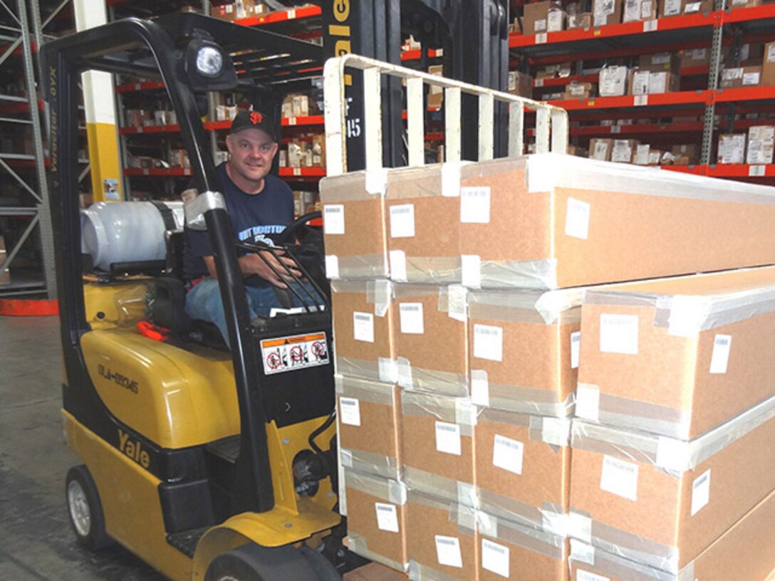 Defense Logistics Agency Aviation's Rick Williamson, an organic manufacturing product specialist with the Engineering Directorate, Richmond, Virginia, drives a fork lift in the not-ready-for-issue warehouse at DLA Distribution San Joaquin in Tracy, California. He participated in a three-month, March – May, 2016, DLA Enterprise Rotation Program. 