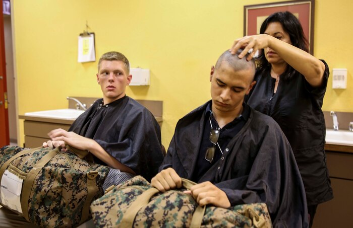 Recruits of Fox Company, 2nd Recruit Training Battalion, receive their initial haircuts at Marine Corps Recruit Depot San Diego, June 27. Recruits receive haircuts immediately after arriving to create uniformity. Annually, more than 17,000 males recruited from the Western Recruiting Region are trained at MCRD San Diego. Fox Company is scheduled to graduate Sept. 23.